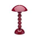 De Addison Ross Bobbin Lamp LED Oplaadbaar Kersenrood is een moderne draadloze lamp met een kersenrood glanzende afwerking, bol segmenten in de voet en een koepelvormige kap, geïnspireerd op het originele Addison Ross ontwerp.