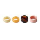 De HK Living Servetring Sunrise 4 st. set bestaat uit stevige crèmekleurige, gele, donkerbruine met swirls en lichtroze glanzende servetringen - ideaal voor een moderne tafelsetting.