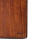 Een close-up van de HK Living Acacia Snijplank 60/15, een rechthoekige plank van acaciahout met een gladde, rijke bruine afwerking. In de hoek rechtsonder is de kleine zwarte tekst "hkliving" gegraveerd. Merk: HK Living.