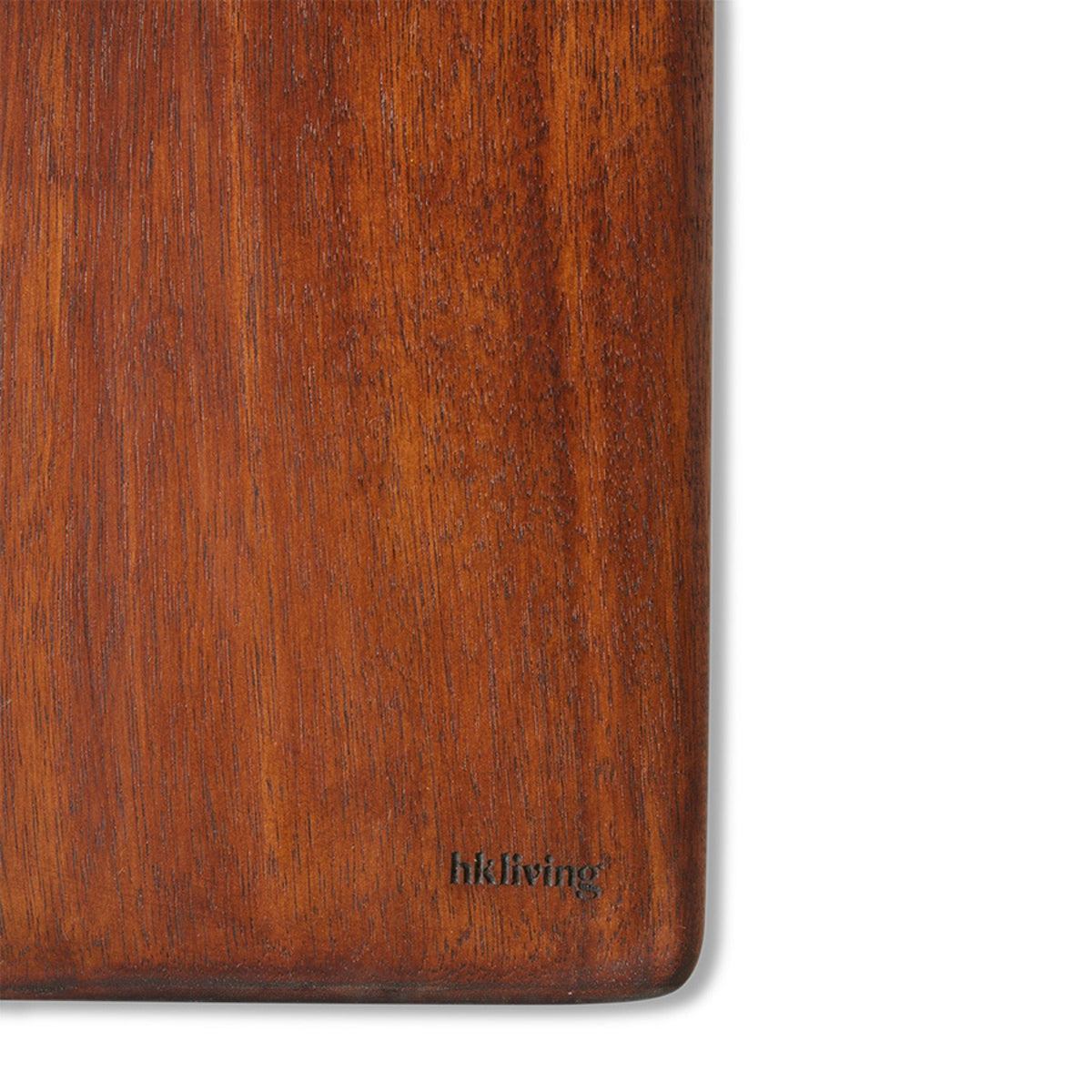 Een close-up van de HK Living Acacia Snijplank 60/15, een rechthoekige plank van acaciahout met een gladde, rijke bruine afwerking. In de hoek rechtsonder is de kleine zwarte tekst "hkliving" gegraveerd. Merk: HK Living.