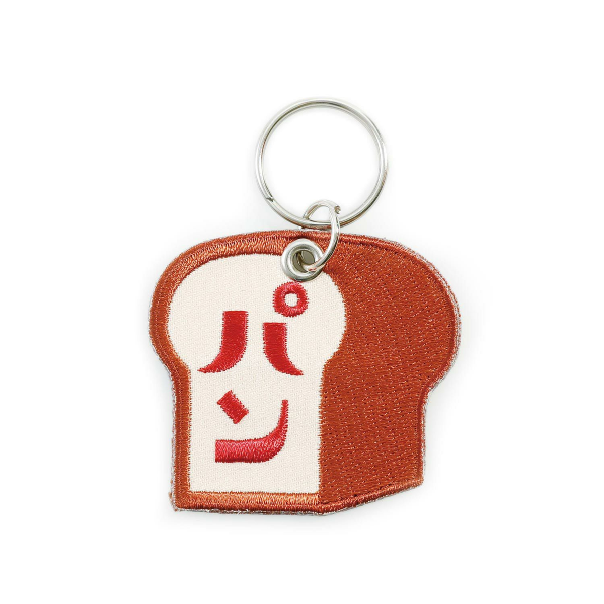 De Hightide Stitch Work Sleutelhanger Brood is een schattige broodvormige sleutelhanger met rode Japanse tekst パン (pan) op de voorkant - perfect voor broodfans en liefhebbers van eigenzinnige Hightide accessoires.