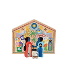 De &Klevering Kerststal Puzzel is een kleurrijke houten kerststal met geïllustreerde figuren - Maria, Jozef, kindje Jezus, dieren en engelen - in een versierde stal met palmbomen en ster. Een charmante vakantieset van &Klevering.