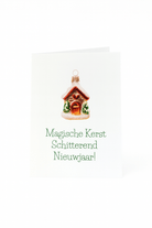 Op de Matriks Kerst- en Nieuwjaarskaart Magische Kerst Schitterend nieuwjaar! staat een unieke kerstbal geschilderd als een huis boven Nederlandse tekst op een witte achtergrond.