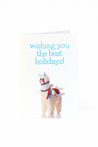 De Matriks Kerst- en Nieuwjaarskaart Wishing You the Best Holidays van Matriks heeft een pluchen lama met een feestelijk zadel en harnas, plus blauwe tekst erboven met de tekst "Wishing you the best holidays!" - een unieke vakantiekaart voor je groeten.