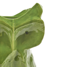 Close-up van de Serax Marni After Midnight Uil Vaas Lichtgroen S, met het glanzende groene keramieken uilengezicht met gedetailleerde oren, ogen en snavel tegen een witte achtergrond - een artistiek stuk van Serax.