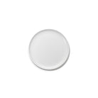 Een effen, rond, wit keramiek Serax Base Laag Bord D24 bord van het merk Serax, gefotografeerd tegen een witte achtergrond.